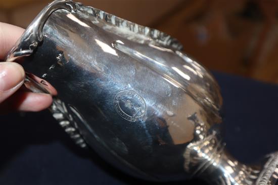 A pair of George III silver pedestal sauceboats, London, 1763?, (repairs), gross 27.5 oz.